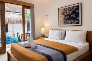 Postel nebo postele na pokoji v ubytování Summer of Surf Canggu