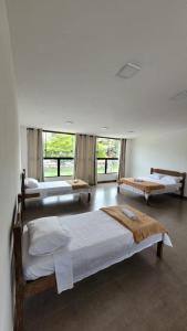 En eller flere senge i et værelse på SuperLoft 200mts do centro historico com garagem