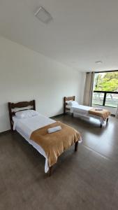 En eller flere senge i et værelse på SuperLoft 200mts do centro historico com garagem