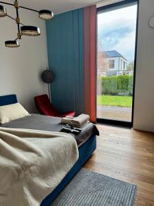 En eller flere senge i et værelse på Mezapark Design Apartments