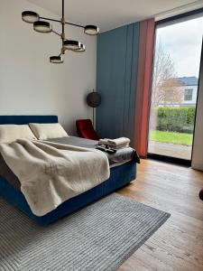 En eller flere senge i et værelse på Mezapark Design Apartments