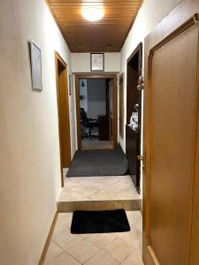 a hallway with a door leading into a room at Stadtwohnung Bruck an der Mur in Bruck an der Mur
