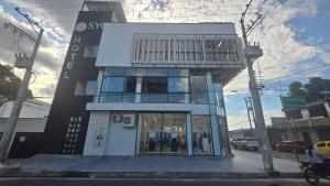 a building with a balcony on top of it at SYC Hotel Boutique in Arauca