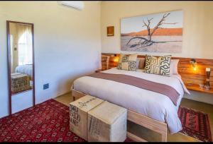 En eller flere senge i et værelse på The Schoolhouse at Meulplaas