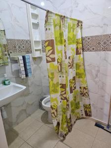 a bathroom with a toilet and a shower curtain at Marrakech plus in Marrakesh +55 photos