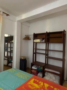 Ένα ή περισσότερα κρεβάτια σε δωμάτιο στο Maison confortable avec jardin au Robert, 40 m², climatisation