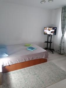 Giường trong phòng chung tại Concordia Apartament +27 ảnh