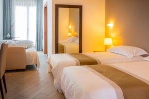 Postel nebo postele na pokoji v ubytování Hotel San Clemente