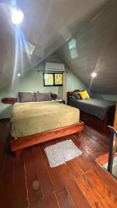 En eller flere senge i et værelse på Cabaña Vacal WiFi, beach front #1