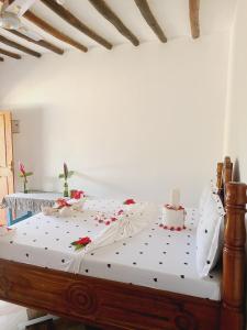 En eller flere senge i et værelse på Sweet Home