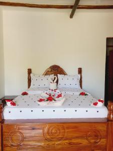 En eller flere senge i et værelse på Sweet Home