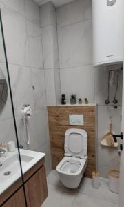 Koupelna v ubytování LD Apartments + 2 fotografie