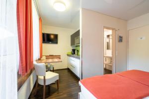 En eller flere senge i et værelse på Apartment - Camping Brunner am See