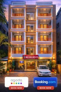 een gebouw met een auto ervoor geparkeerd bij Baral White Rose Hotel in Dhaka