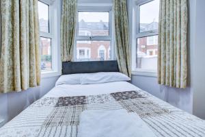 Postel nebo postele na pokoji v ubytování Taq apartment