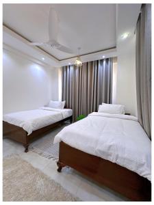 En eller flere senge i et værelse på Sandy shores apartments