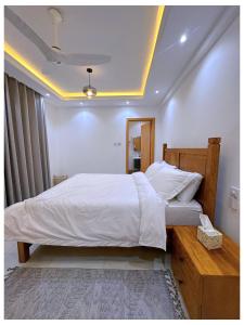 En eller flere senge i et værelse på Sandy shores apartments