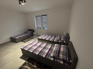 Postel nebo postele na pokoji v ubytování Apartamenty Przy Rynku Gąsawa/Biskupin