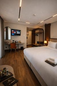 a hotel room with a bed and a desk at Mandala Karaköy Hotel in Istanbul