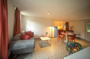 a living room with a couch and a table at Loft 4 in Schleiden