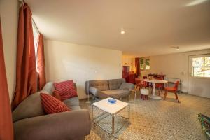 a living room with a couch and a table at Loft 4 in Schleiden