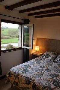 Postel nebo postele na pokoji v ubytování Le moulin de vaux