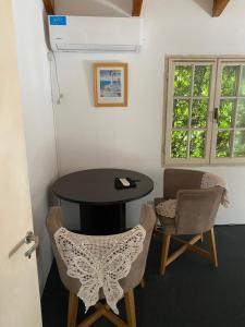 a room with a table and two chairs at Felicidades in Rosario