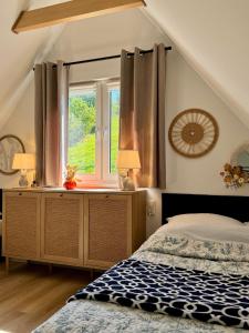 En eller flere senge i et værelse på Zajęcza Nora, balia ogrodowa