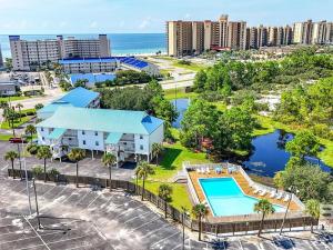 an aerial view of a resort with a swimming pool at Latitude 302 in Orange Beach