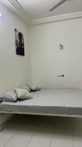 En eller flere senge i et værelse på Les Residences Belani - Cadjehoun, Cotonou