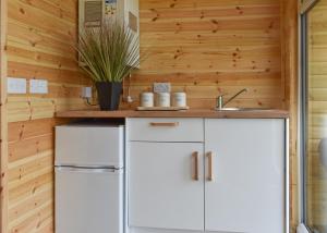 a kitchen with a white refrigerator and a counter at Fine Country Stays in Bubwith