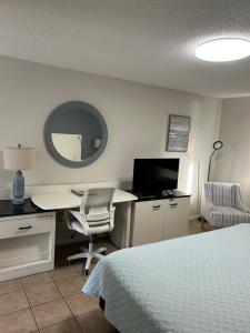 Μια τηλεόραση ή/και κέντρο ψυχαγωγίας στο Sand Pebble Motor Lodge