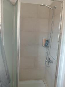 a shower with a glass door in a bathroom at Sea Breeze Ecological Villa in Agia Galini +44 photos