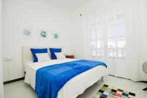 En eller flere senge i et værelse på Casa Elena Playa - By AZ Rentals