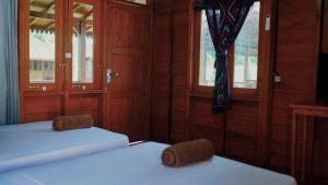 En eller flere senge i et værelse på Welly Bungalow + 93 billeder