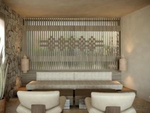 ein Wohnzimmer mit einer Bank und zwei Stühlen in der Unterkunft The Revery - Luxury Suites & Tented Pavilions, Elafonisi - Adults Friendly in Livadia