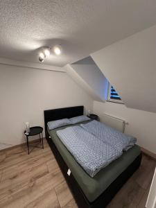 En eller flere senge i et værelse på Ferienwohnung AyNa 3, direkt an der Schweizer Grenze