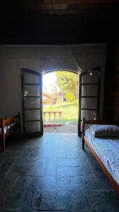 Postel nebo postele na pokoji v ubytování Sítio pousada recanto curió