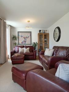 Et opholdsområde på Modern 4 Bed Highland Home