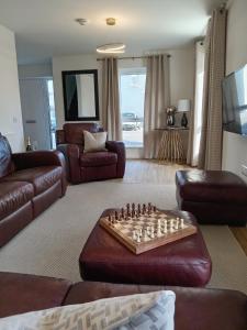 Et tv og/eller underholdning på Modern 4 Bed Highland Home