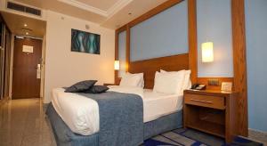 Voodi või voodid majutusasutuse Eko Hotel Main Building toas