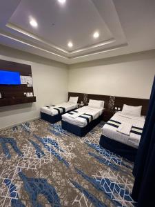 Postel nebo postele na pokoji v ubytování فندق الماسة ذاخر + 30 fotografií