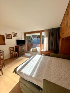 Ένα ή περισσότερα κρεβάτια σε δωμάτιο στο Monolocale Collini