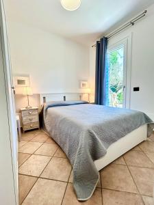 Ένα ή περισσότερα κρεβάτια σε δωμάτιο στο Elegant villa in the idyllic island of Albarella +22 φωτογραφίες