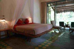 Giường trong phòng chung tại Saiwa Safari Resort