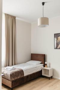 Postel nebo postele na pokoji v ubytování Wilczy Sen