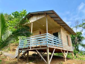 a small wooden house with a large porch at 7 Ventos in Alto Douro