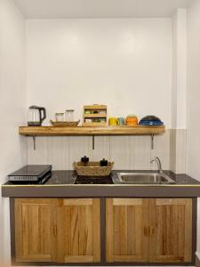 a kitchen with a sink and a counter top at Gym house in San Vicente +15 photos