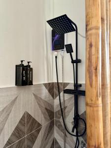 a clock on a stand in a room at Gym house in San Vicente +15 photos