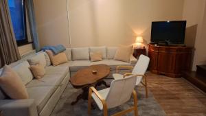 a living room with a couch and a table at Al-Dino in Sarajevo